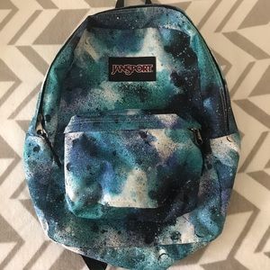 Blue and black Jansport backpack.